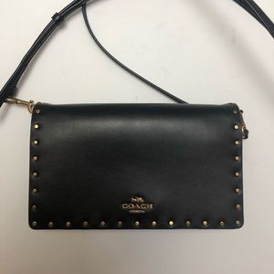 Coach foldover cross body clutch.